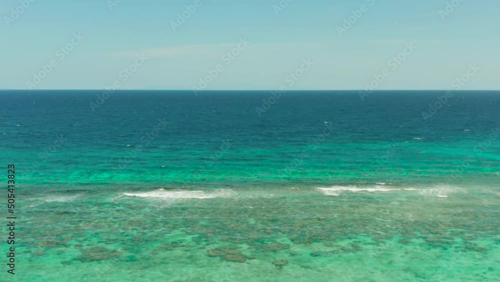 Blue background with transparent sea water copy space for text. Sea water surface in lagoon and coral reef. Top view transparent turquoise ocean water surface. background texture Blue background with transparent sea water copy space for text. Sea water surface in lagoon and coral reef. Top view transparent turquoise ocean water surface. background texture