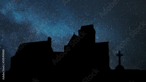 Iona Abbey and St. John's Cross by Night, Time Lapse with Stars and Milky Way in Background, Scotland photo