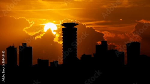 Nairobi Cityscape, capital city of Kenya, Time Lapse at Sunset with Red Sky and Fiery Sun, East Africa photo