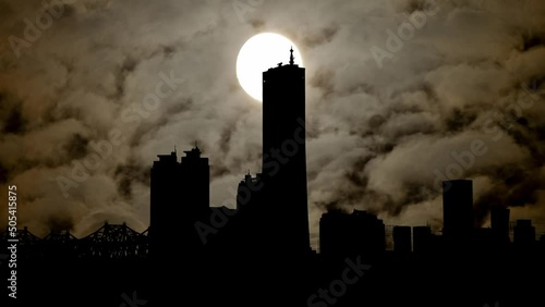 Seoul: Skyline of Yeouido Financial district by Night with Dark Atmosphere, Fog, Smoke, and Full Moon, South Korea photo