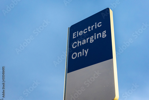 Electric vehicle recharging point sign post in England UK