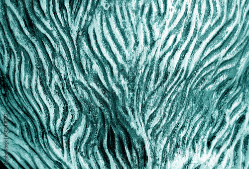 Metal rough surface with blur effect in cyan tone.