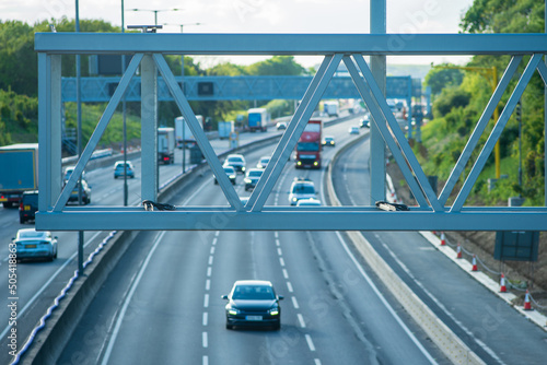 new built smart motorway traffic sign holder structure over moving traffic in england uk photo