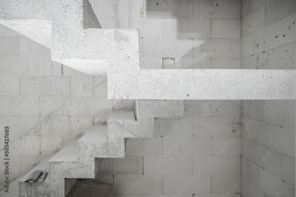 Raw Concrete Stairs in a Residential Blocks Made Building Construction Industry Theme. Raw Concrete Stairs in a Residential Blocks Made Building Construction Industry Theme.