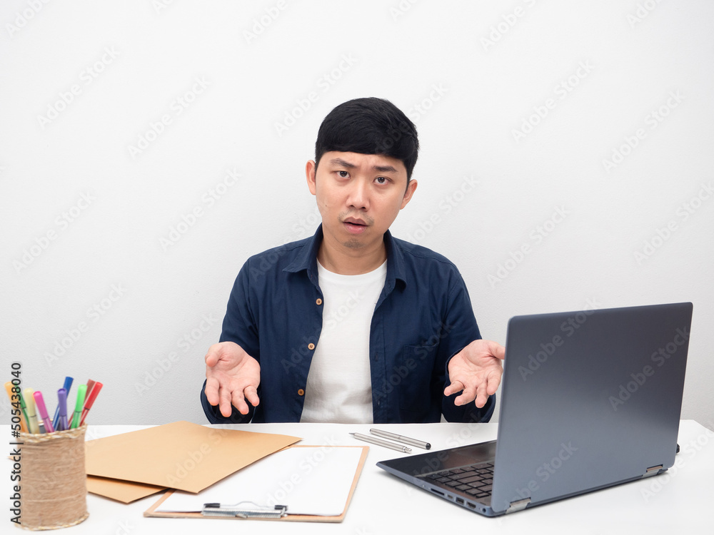 Male employee sitting at office workplace feel bored about work on the table Male employee sitting at office workplace feel bored about work on the table