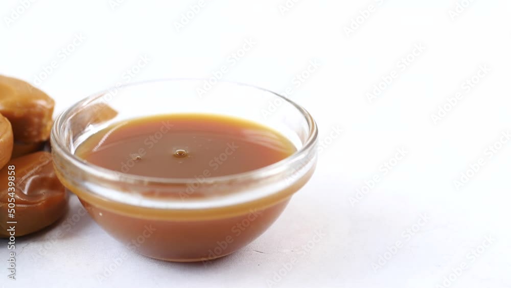 caramel chocolate bar and liquid on table top view caramel chocolate bar and liquid on table top view
