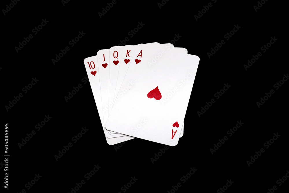 Royal Flush with hearts poker hand isolated on black background