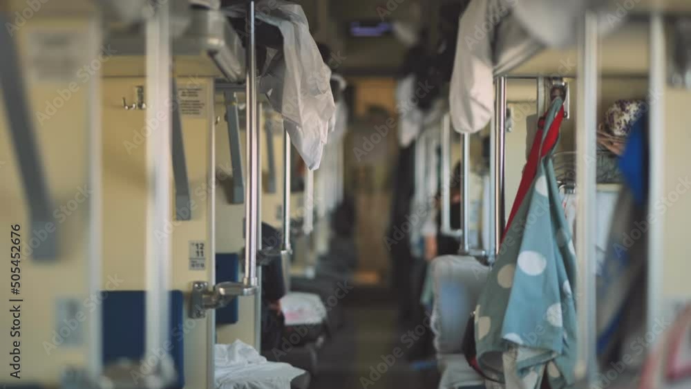Second-class carriage with passengers in the Russian train. Long distance trains. Second-class carriage with passengers in the Russian train. Long distance trains.