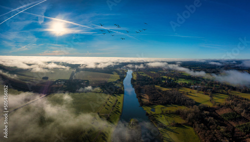 Photography Aerial view of cityscape Henley-on-Thames surrounded by greenery fields and wate