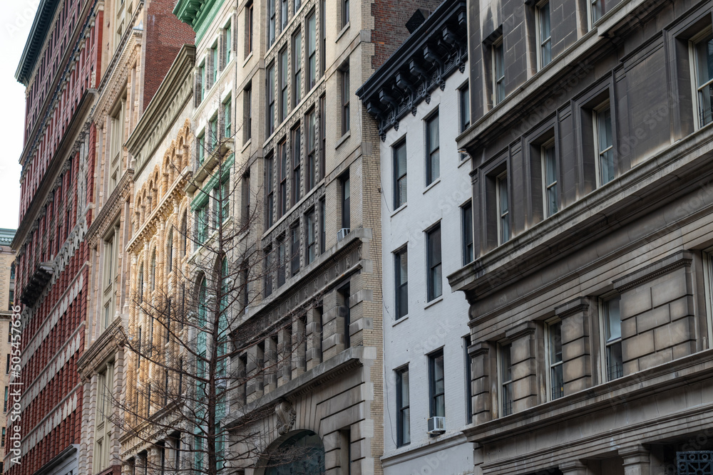 Row of Beautiful Old and Colorful Buildings along a Street in Chelsea of New York City Row of Beautiful Old and Colorful Buildings along a Street in Chelsea of New York City