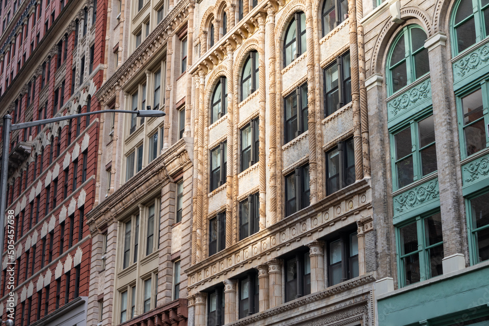 Row of Beautiful Old and Colorful Buildings along a Street in Chelsea of New York City Row of Beautiful Old and Colorful Buildings along a Street in Chelsea of New York City