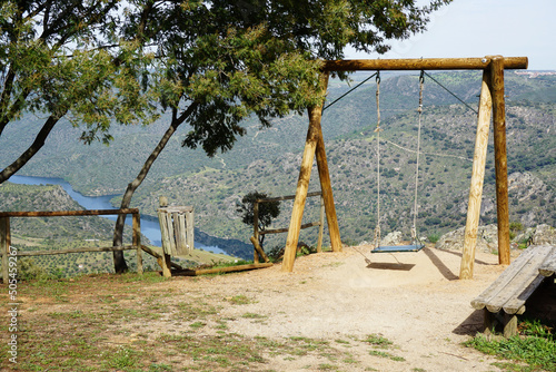 Wooden swing at Penedo Durao, with a beautiful view of River Douro, in the north of Portugal.

 photo