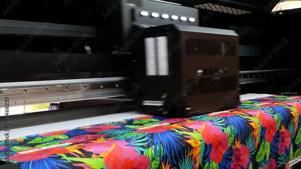 The plotter prints on a textile fabric. Production process in a ...