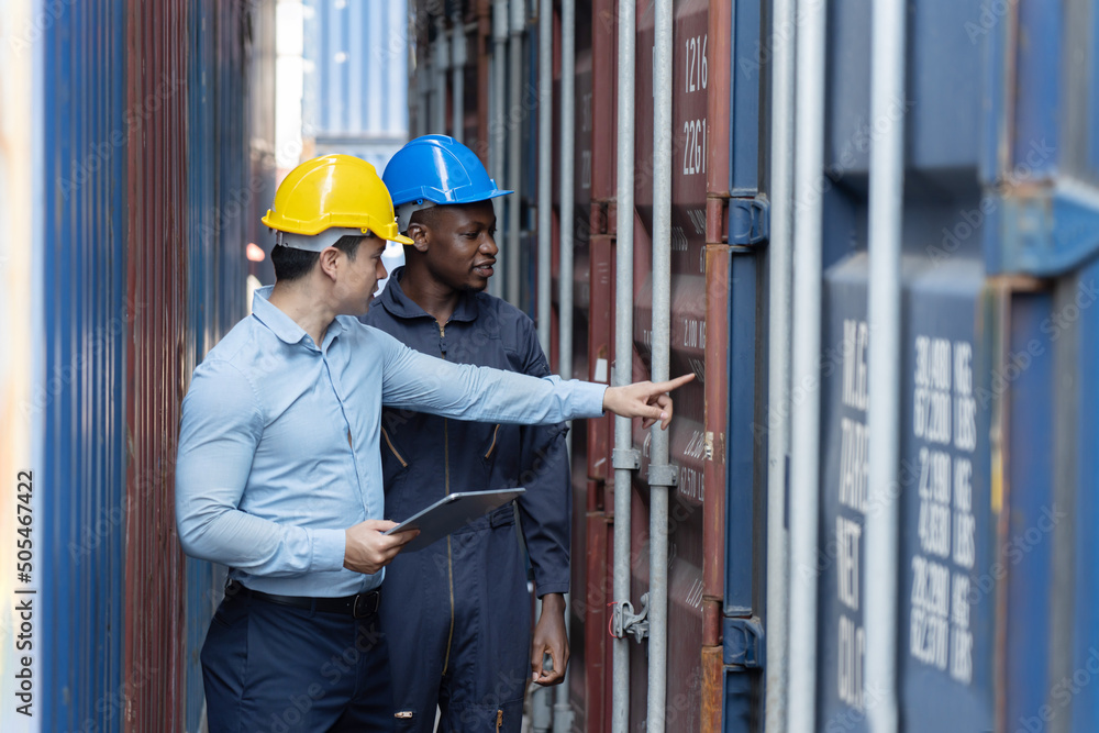 Caucasian Inspectors Inspecting the Containers at the Port Caucasian Inspectors Inspecting the Containers at the Port