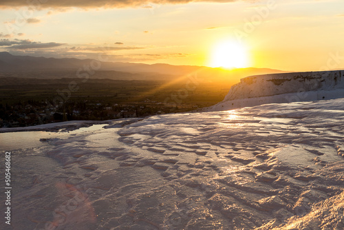 A carbonate mineral left by the flowing of thermal spring water during sunset  Pamukkale  Turkey