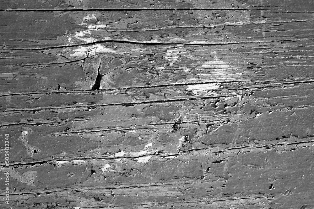 Φωτογραφία evocative black and white close-up image of the surface of an old blue wooden pl