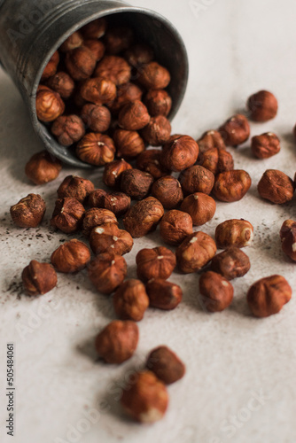 pile of raw hazelnut on white background