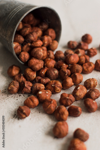 pile of raw hazelnut on white background