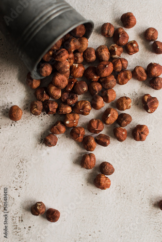 pile of raw hazelnut on white background