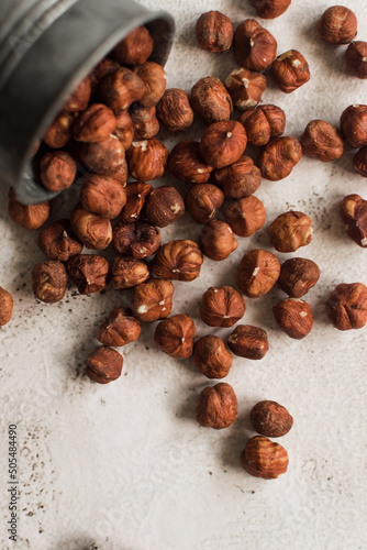 pile of raw hazelnut on white background