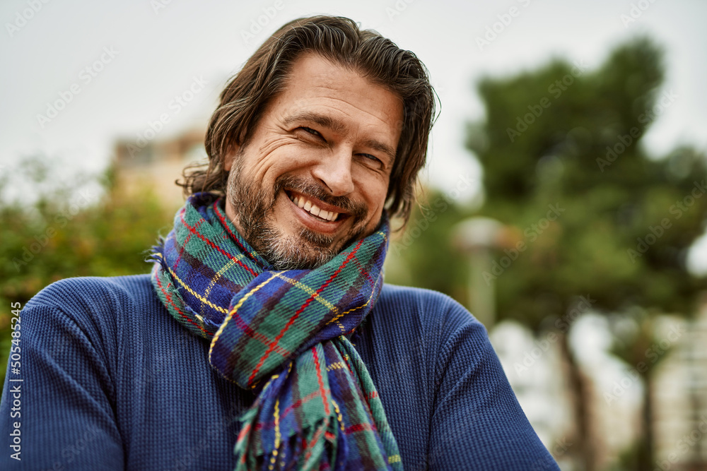 Middle age handsome man smiling at the town Middle age handsome man smiling at the town