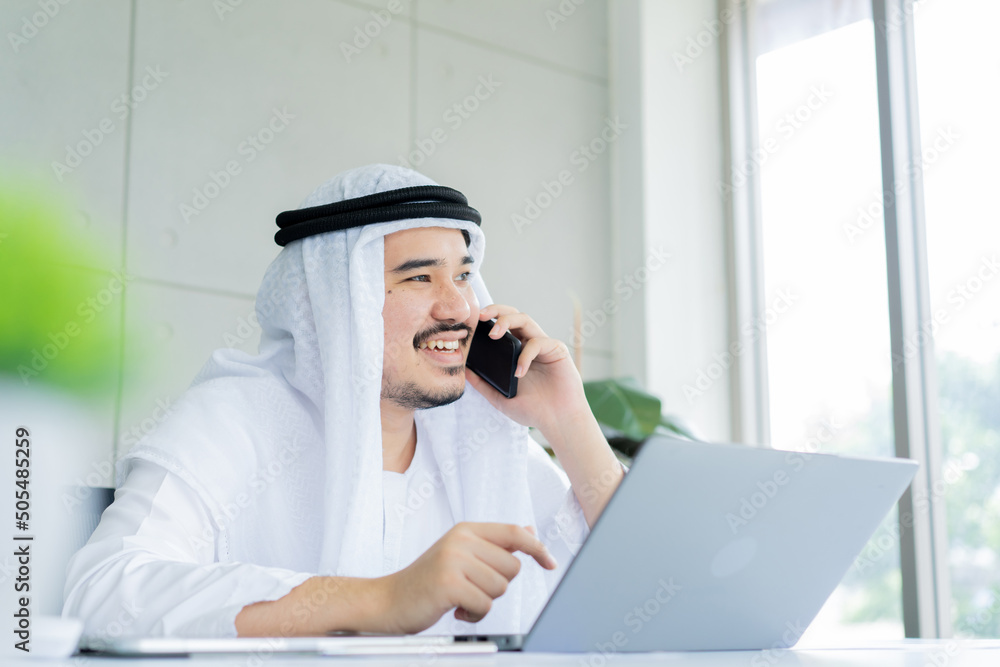 close up Arab businessman use smartphone to call or consult with colleagues or provider about financial project in office for working. lifestyle concept close up Arab businessman use smartphone to call or consult with colleagues or provider about financial project in office for working. lifestyle concept
