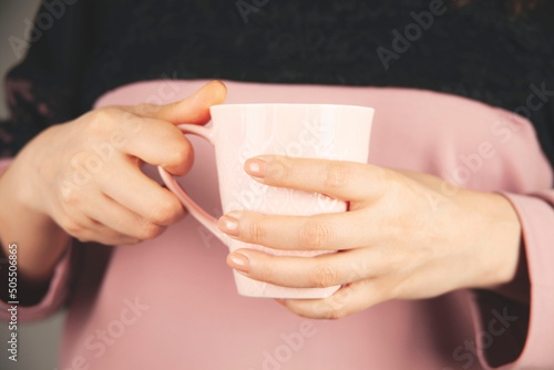 woman hand cup of tea or coffee