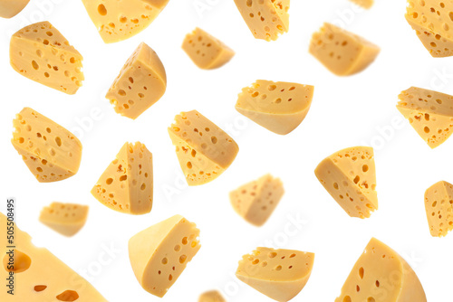Falling cheese, isolated on white background, selective focus. Maasdam cheese