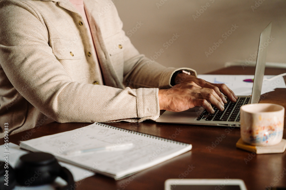 Male hands typing on keyboard