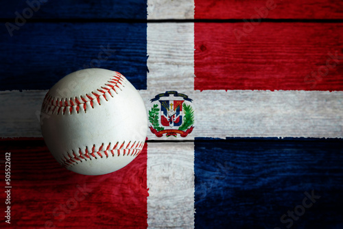 Canvas Print Leather Baseball on Rustic Wooden Background Painted With Dominican Flag