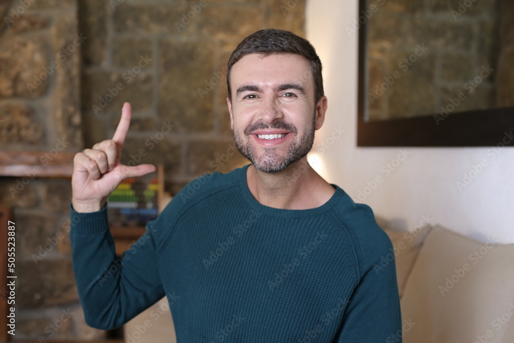 Man doing size comparison with fingers Man doing size comparison with fingers