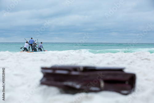 The annual board meeting comes as we face challenging times ahead, but now businessmen set to sail on the turquoise sea using only a raft and leaving the briefcase behind on the white sandy beach. 