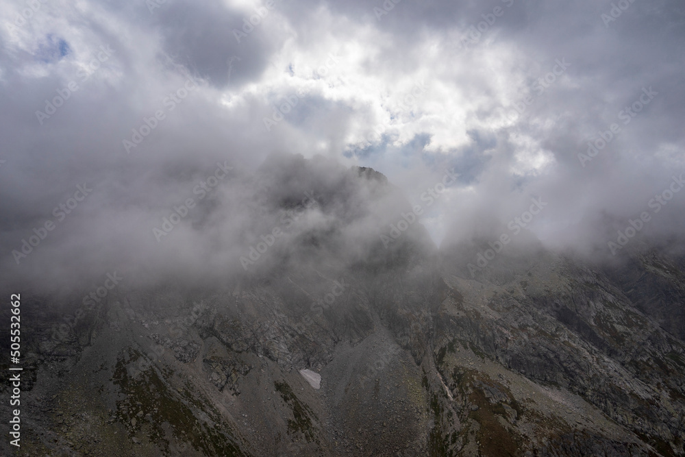 Orla Perc high mountain trail under the clouds. High Tatras.