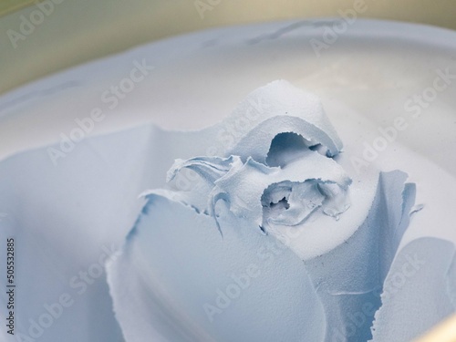 Fotografi putty for car repair. blue polyester putty in a jar.