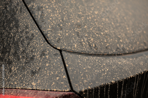 the black varnish of a car with sahara dust