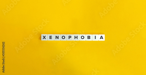 Xenophobia Banner. Letter Tiles on Yellow Background. Minimal Aesthetics.