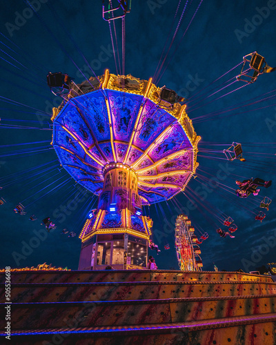Valokuvatapetti Beautiful view of a carousel in the amusement park at night