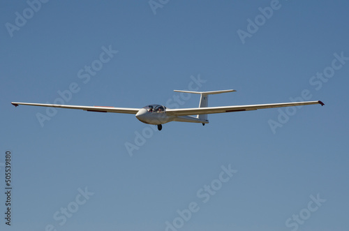 ultralight glider with blue sky background