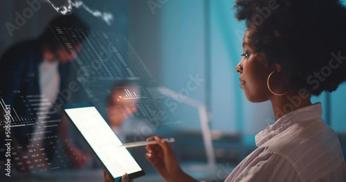 African-American financial specalist analyze stock market data using tablet hologram technology