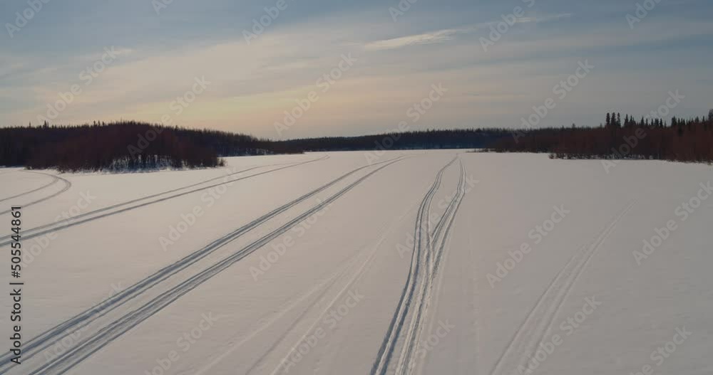 Snowmobile tracks in the snow in the Kenai National Wildlife Refuge, Alaska Snowmobile tracks in the snow in the Kenai National Wildlife Refuge, Alaska