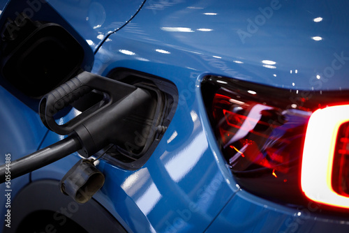 Foto Loading energy of an electric blue car