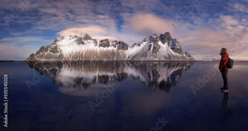 Reflections over the sand of the stuckness beach in Iceland photo