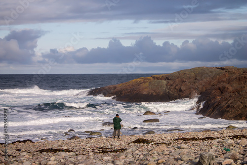 person walking on the beach
