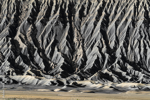 Textured detail of the Based of eroded Butte in the Caineville Badlands of Utah photo