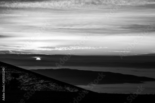 View of Umbria valley Italy above a sea of fog at sunset