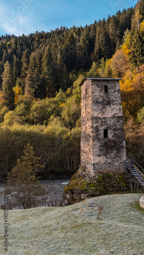 Old watchtower at the edge of the forest photo