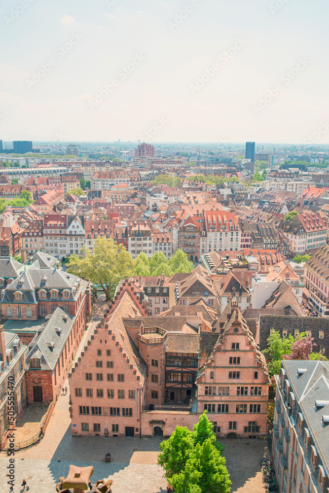 Beautiful panoramic view to old town of Strasbourg, Alsase, France. Old medieval buildings with orange roofs. 