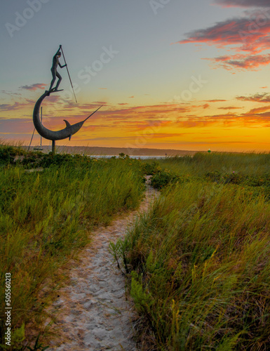 Harpoon statue sculpture at sunset by the beach on Martha's vineyard in New England photo