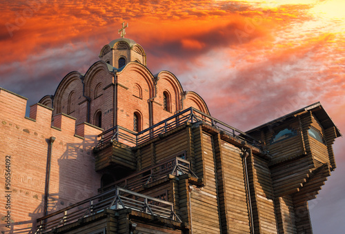 Ancient Golden Gate with a dome of Annunciation Church in Kiev against a dramatic evening sky. Capital of Ukraine - Kyiv city photo