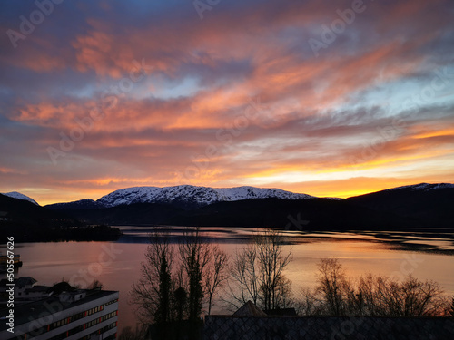 Breathtaking view of the Samnangerfjord in Samnanger on colorful sunset sky background photo
